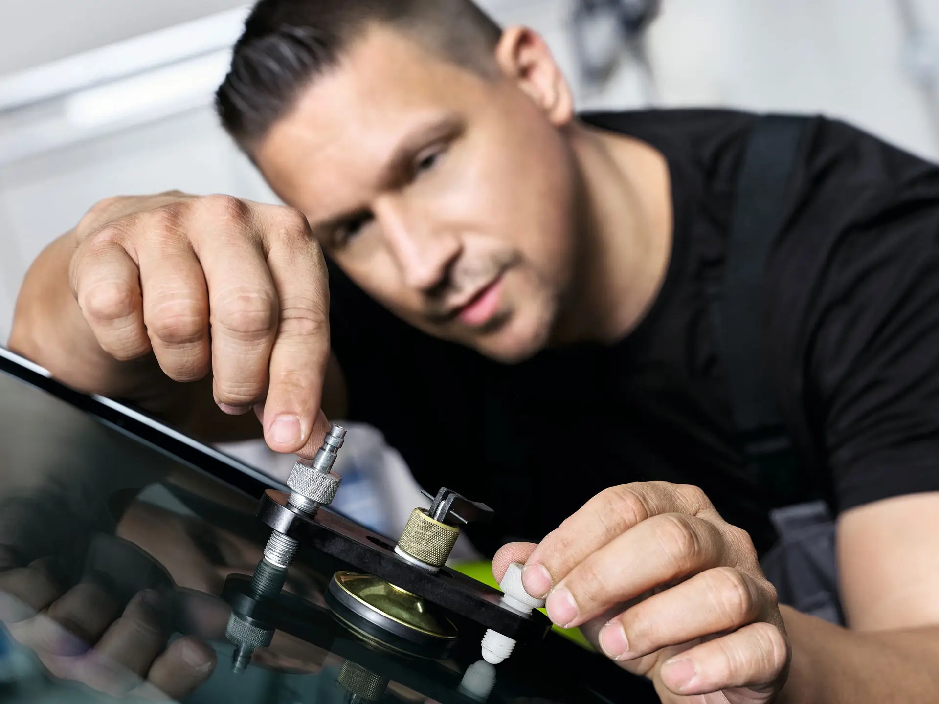 MINI employee repairs windshield.